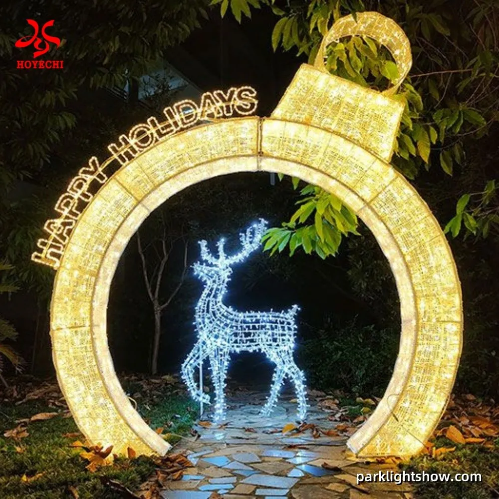 Large 3-meter Christmas ornament arch light decorated with waterproof LED string lights and PVC tinsel, designed by HOYECHI for parks and commercial festive installations Large 3-meter Christmas ornament arch light decorated with waterproof LED string lights and PVC tinsel, designed by HOYECHI for parks and commercial festive installations
